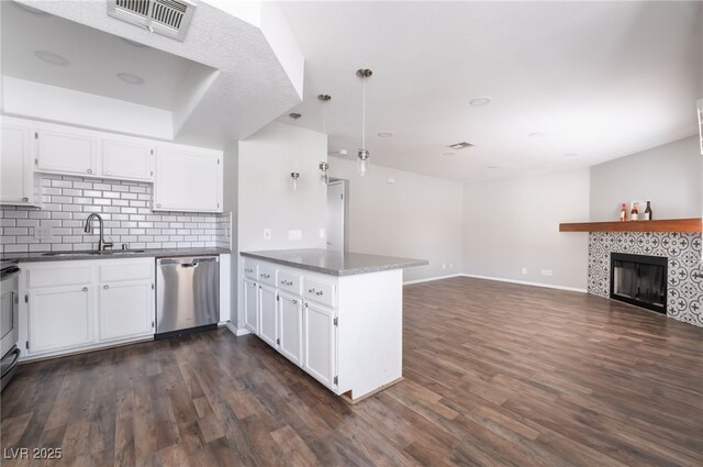 912 Falconhead Ln Unit 101, Las Vegas, NV 89128 - kitchen with a sink, white cabinetry, a peninsula, and dishwasher