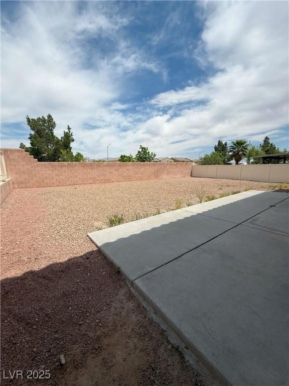 view of yard featuring a fenced backyard and a patio area