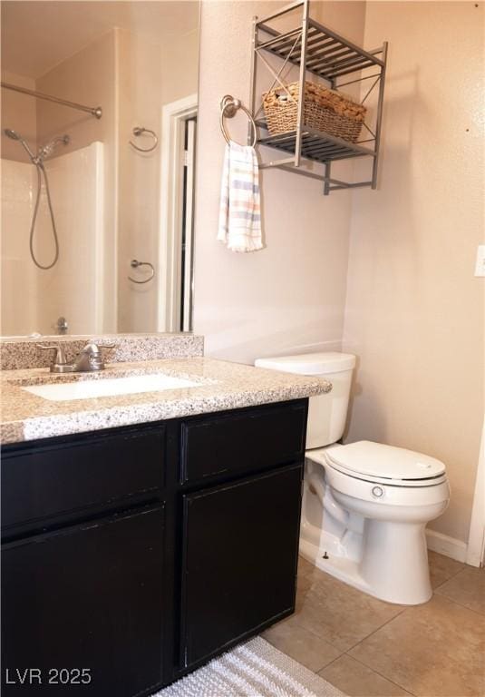 bathroom with tile patterned flooring, a shower, toilet, and vanity