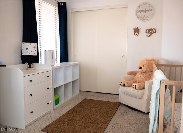bedroom featuring a crib