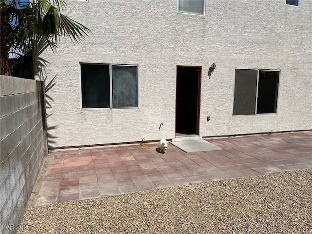 1249 Lucia Dr, Las Vegas, NV 89128 - back of house with a patio, stucco siding, and fence