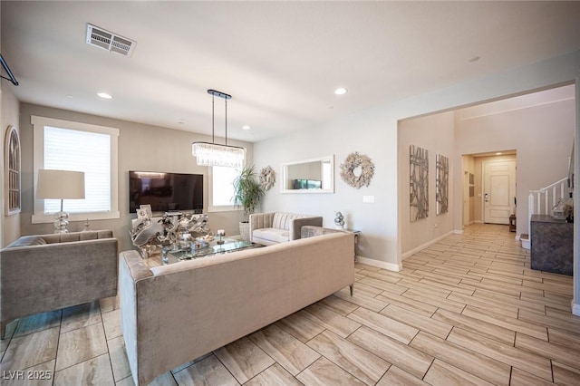 2198 Maderno St, Henderson, NV 89044 - living area featuring stairway, wood tiled floor, recessed lighting, and visible vents
