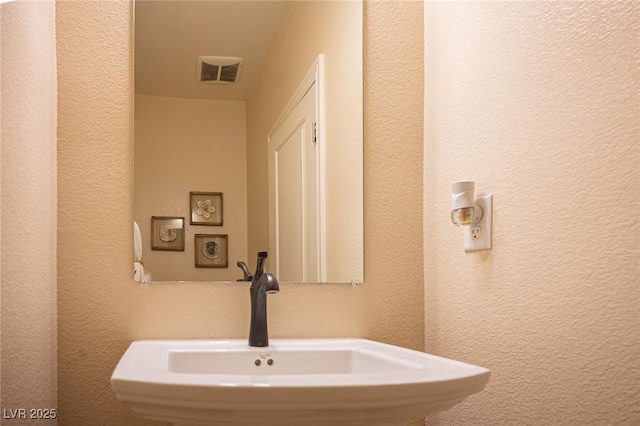 2198 Maderno St, Henderson, NV 89044 - bathroom featuring visible vents, a sink, and a textured wall