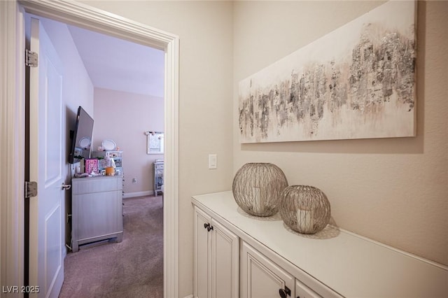 2198 Maderno St, Henderson, NV 89044 - corridor featuring baseboards and dark colored carpet