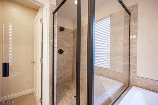 2198 Maderno St, Henderson, NV 89044 - bathroom with tile patterned flooring, a bath, a stall shower, and a wealth of natural light