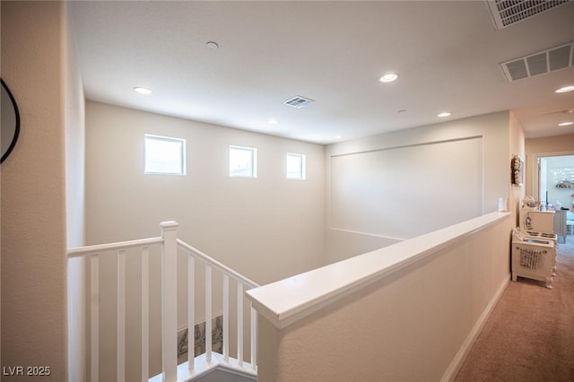 2198 Maderno St, Henderson, NV 89044 - hallway featuring visible vents, carpet floors, and an upstairs landing