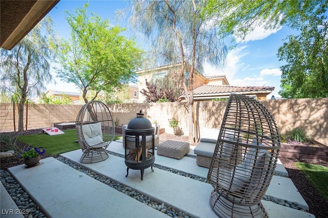 2198 Maderno St, Henderson, NV 89044 - view of patio / terrace featuring a fenced backyard and an outdoor fire pit