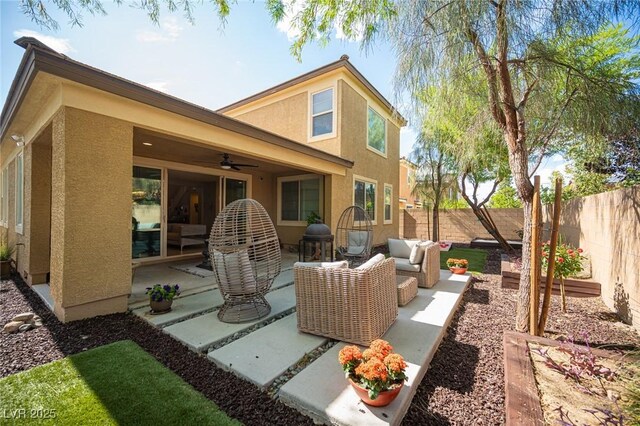 2198 Maderno St, Henderson, NV 89044 - back of property featuring ceiling fan, a fenced backyard, a patio, outdoor lounge area, and stucco siding