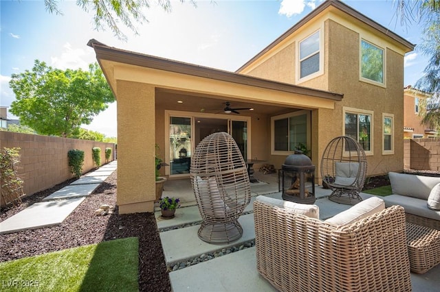 2198 Maderno St, Henderson, NV 89044 - back of house with ceiling fan, fence, an outdoor hangout area, a patio, and stucco siding