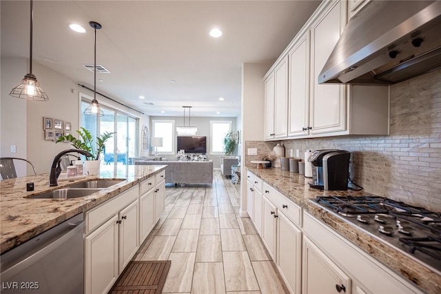 2198 Maderno St, Henderson, NV 89044 - kitchen with exhaust hood, appliances with stainless steel finishes, a sink, tasteful backsplash, and visible vents