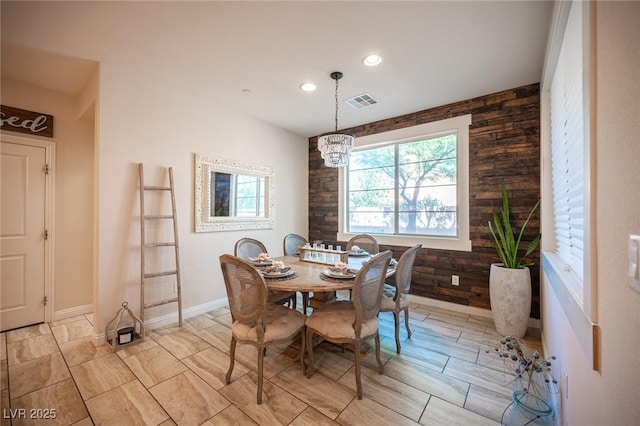 2198 Maderno St, Henderson, NV 89044 - dining room with a chandelier, wood walls, recessed lighting, baseboards, and visible vents