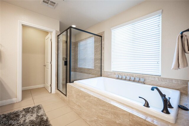 2198 Maderno St, Henderson, NV 89044 - bathroom featuring visible vents, tile patterned flooring, a bath, and a shower stall