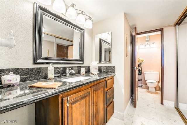 750 S Royal Crest Cir Unit 317, Las Vegas, NV 89169 - bathroom with toilet, vanity, and tile patterned flooring
