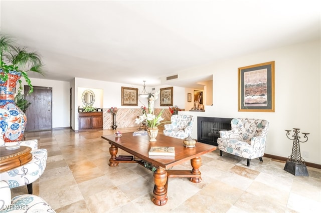 750 S Royal Crest Cir Unit 317, Las Vegas, NV 89169 - living area with a fireplace and baseboards