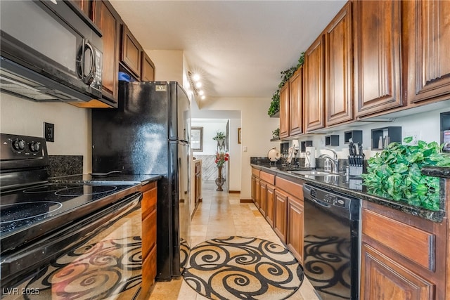 750 S Royal Crest Cir Unit 317, Las Vegas, NV 89169 - kitchen with black appliances, a sink, light tile patterned flooring, and brown cabinets