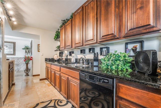 750 S Royal Crest Cir Unit 317, Las Vegas, NV 89169 - kitchen featuring dishwasher, a sink, dark stone countertops, light tile patterned flooring, and baseboards