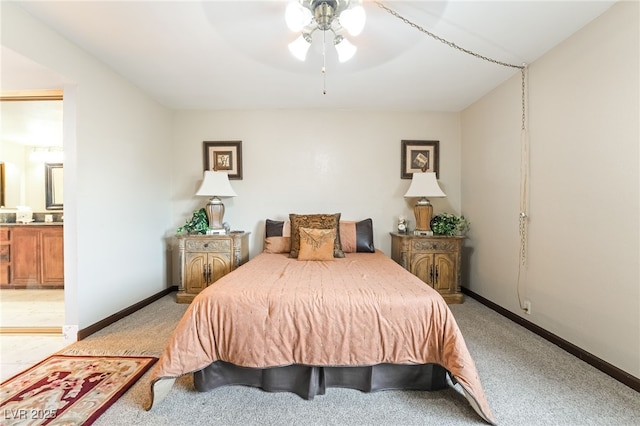750 S Royal Crest Cir Unit 317, Las Vegas, NV 89169 - bedroom featuring light carpet, baseboards, ensuite bathroom, and ceiling fan