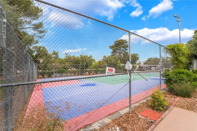 750 S Royal Crest Cir Unit 317, Las Vegas, NV 89169 - view of tennis court featuring community basketball court and fence