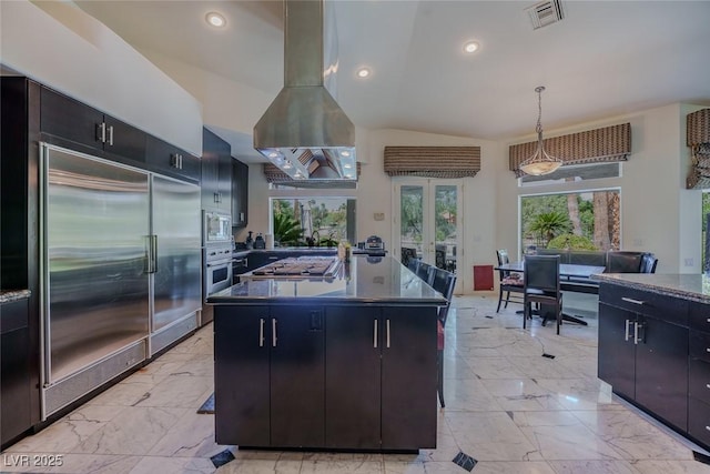 72 Innisbrook Ave, Las Vegas, NV 89113 - kitchen featuring built in appliances, dark countertops, light marble finish flooring, french doors, and decorative light fixtures
