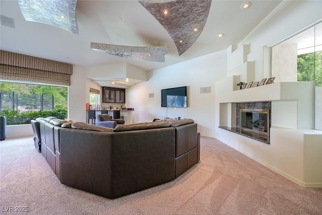 72 Innisbrook Ave, Las Vegas, NV 89113 - living area featuring carpet, a premium fireplace, recessed lighting, baseboards, and high vaulted ceiling