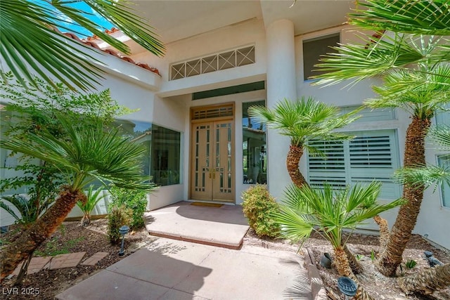 72 Innisbrook Ave, Las Vegas, NV 89113 - view of exterior entry with stucco siding and french doors