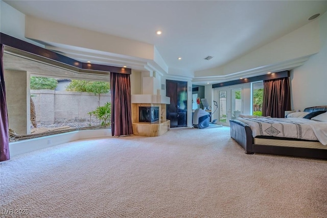 72 Innisbrook Ave, Las Vegas, NV 89113 - bedroom with carpet, access to exterior, a tiled fireplace, french doors, and recessed lighting