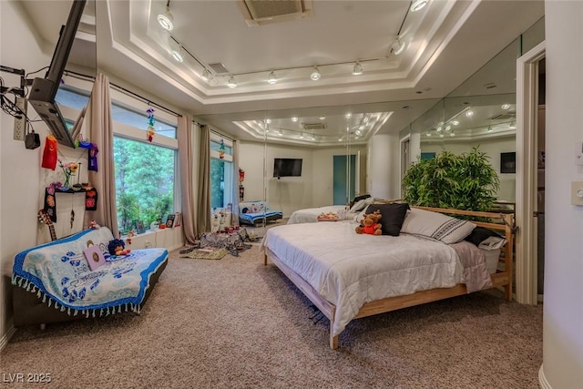 72 Innisbrook Ave, Las Vegas, NV 89113 - carpeted bedroom featuring rail lighting and a raised ceiling