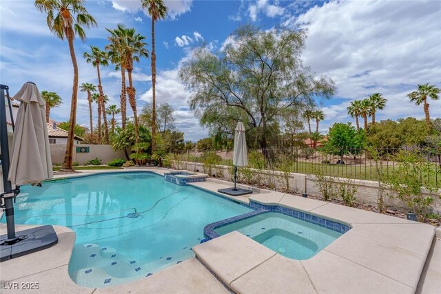 72 Innisbrook Ave, Las Vegas, NV 89113 - view of pool with a pool with connected hot tub and a fenced backyard