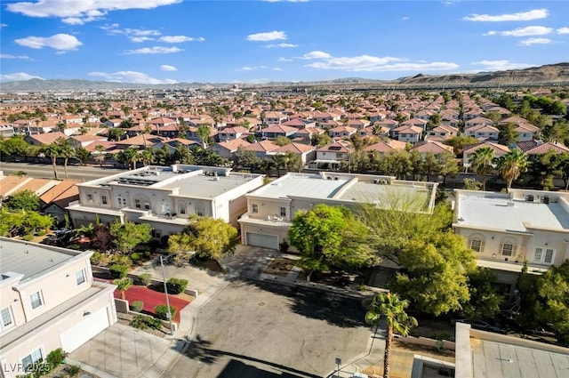birds eye view of property with a residential view and a mountain view