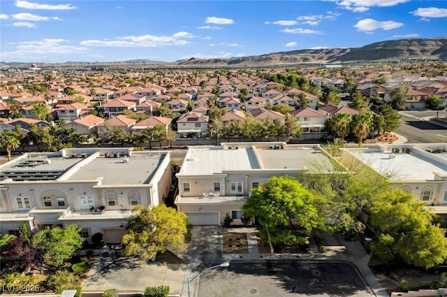 birds eye view of property with a residential view and a mountain view