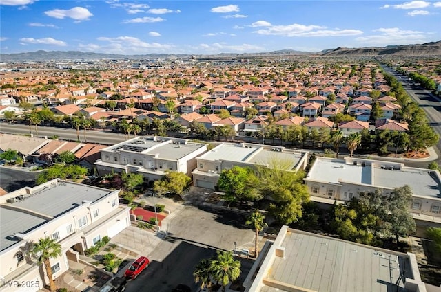 birds eye view of property with a mountain view and a residential view