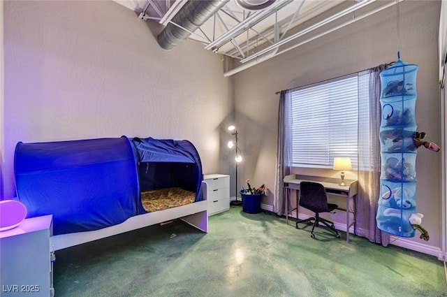 bedroom featuring concrete floors