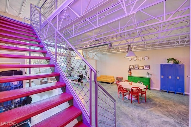 staircase with carpet floors and baseboards