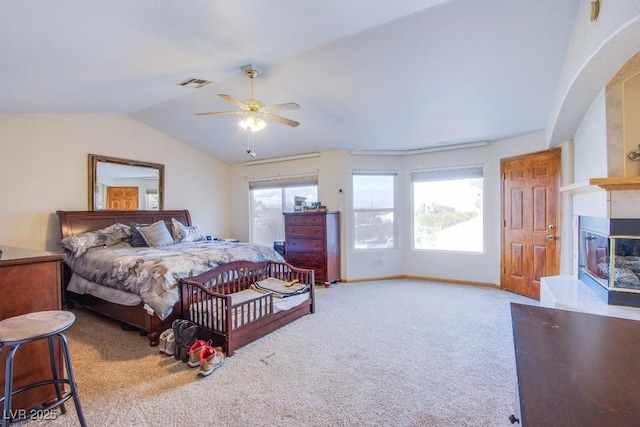 5180 N Dapple Gray Rd, Las Vegas, NV 89149 - bedroom featuring a large fireplace, vaulted ceiling, carpet, arched walkways, and ceiling fan