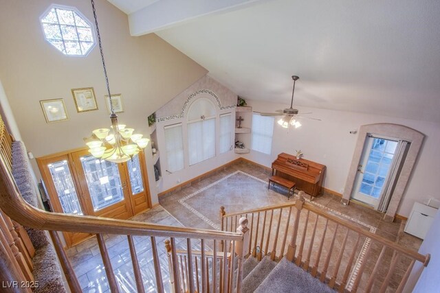 5180 N Dapple Gray Rd, Las Vegas, NV 89149 - stairs featuring a chandelier, a ceiling fan, high vaulted ceiling, and baseboards