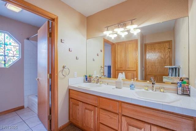 5180 N Dapple Gray Rd, Las Vegas, NV 89149 - full bathroom featuring tile patterned floors, double vanity, and washtub / shower combination