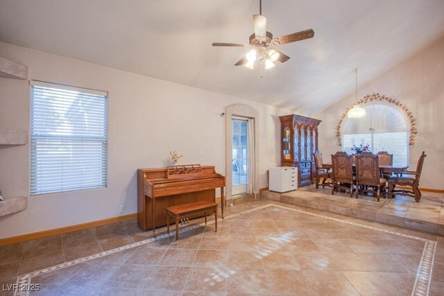 5180 N Dapple Gray Rd, Las Vegas, NV 89149 - living area featuring vaulted ceiling, ceiling fan, healthy amount of natural light, and tile patterned flooring