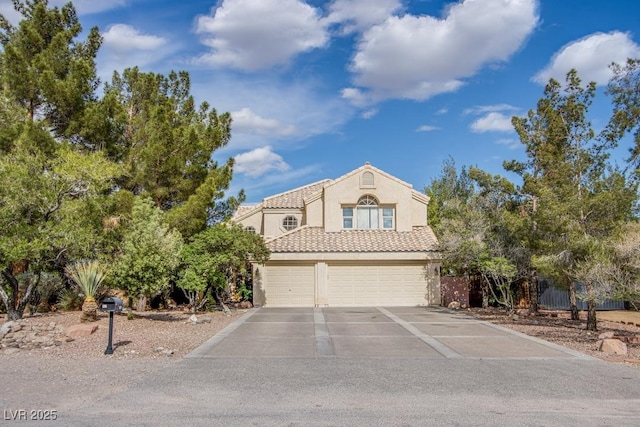 5180 N Dapple Gray Rd, Las Vegas, NV 89149 - view of front of home with stucco siding, driveway, an attached garage, and a tile roof