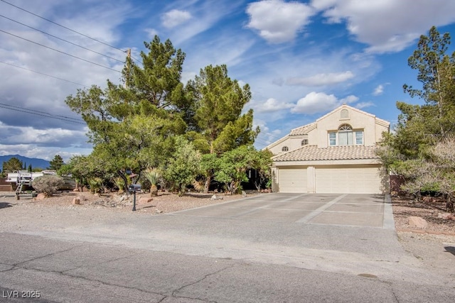5180 N Dapple Gray Rd, Las Vegas, NV 89149 - view of front facade with concrete driveway, stucco siding, and an attached garage
