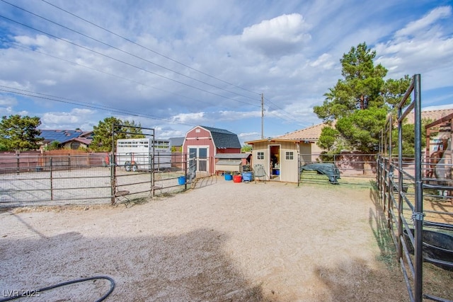 5180 N Dapple Gray Rd, Las Vegas, NV 89149 - view of yard with an outbuilding, a storage shed, and an exterior structure