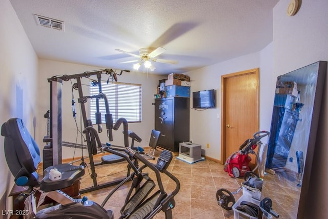 5180 N Dapple Gray Rd, Las Vegas, NV 89149 - exercise area with ceiling fan, baseboards, light tile patterned flooring, and a textured ceiling