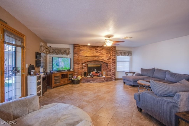 5180 N Dapple Gray Rd, Las Vegas, NV 89149 - living area featuring light tile patterned flooring, a ceiling fan, and a fireplace
