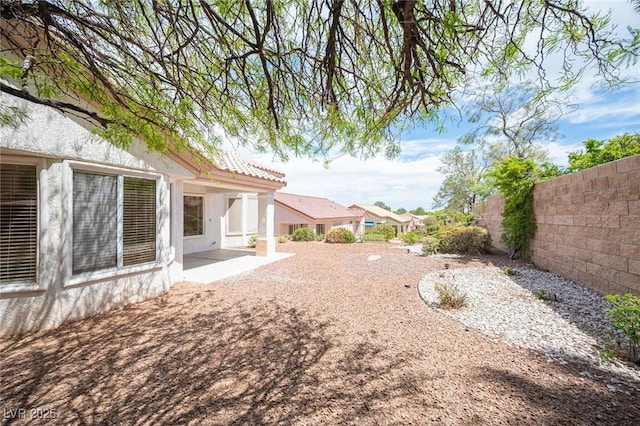 view of yard featuring a patio area and fence