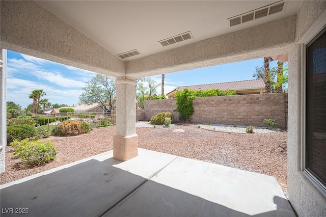 view of patio featuring a fenced backyard and visible vents