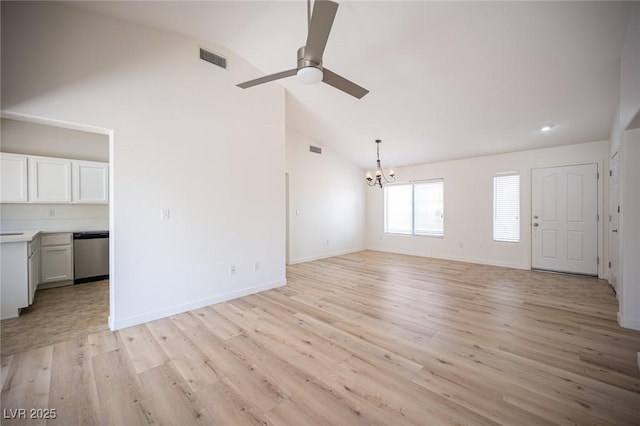 unfurnished living room featuring visible vents, light wood-style flooring, and ceiling fan with notable chandelier