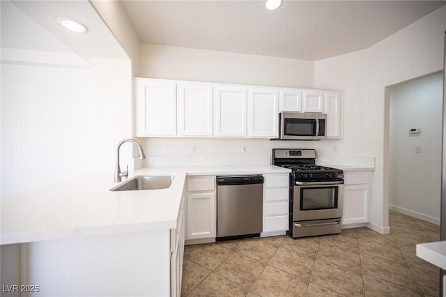 kitchen with white cabinetry, appliances with stainless steel finishes, and a sink