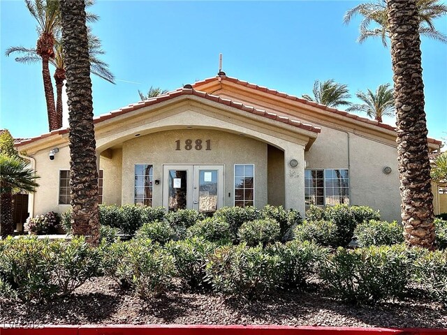 1881 W Alexander Rd Unit 1128, North Las Vegas, NV 89032 - entrance to property featuring stucco siding and a tiled roof