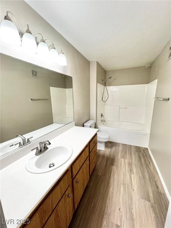 1881 W Alexander Rd Unit 1128, North Las Vegas, NV 89032 - bathroom featuring wood finished floors, vanity, and tub / shower combination