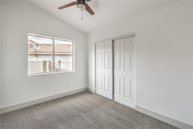 7413 Red Eagle St, Las Vegas, NV 89131 - unfurnished bedroom with carpet flooring, vaulted ceiling, a closet, baseboards, and ceiling fan