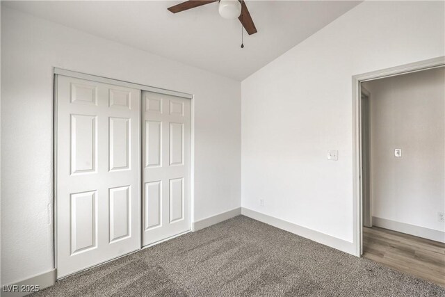 7413 Red Eagle St, Las Vegas, NV 89131 - unfurnished bedroom featuring carpet floors, a closet, vaulted ceiling, ceiling fan, and baseboards